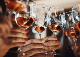 cheers with wine in glasses